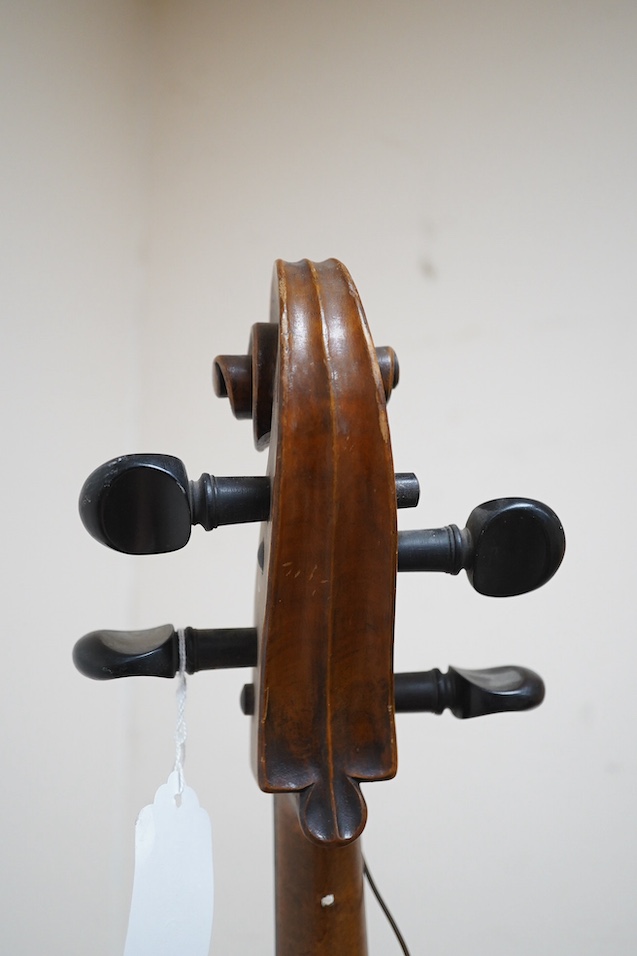 A late 19th century small cello, unsigned and without label inside body, stamped inventory number 769, length of back 62cm. Condition - poor to fair